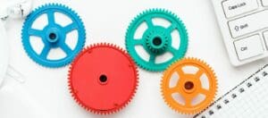 workflow and teamwork concepts with colorful gears and different gadgets
